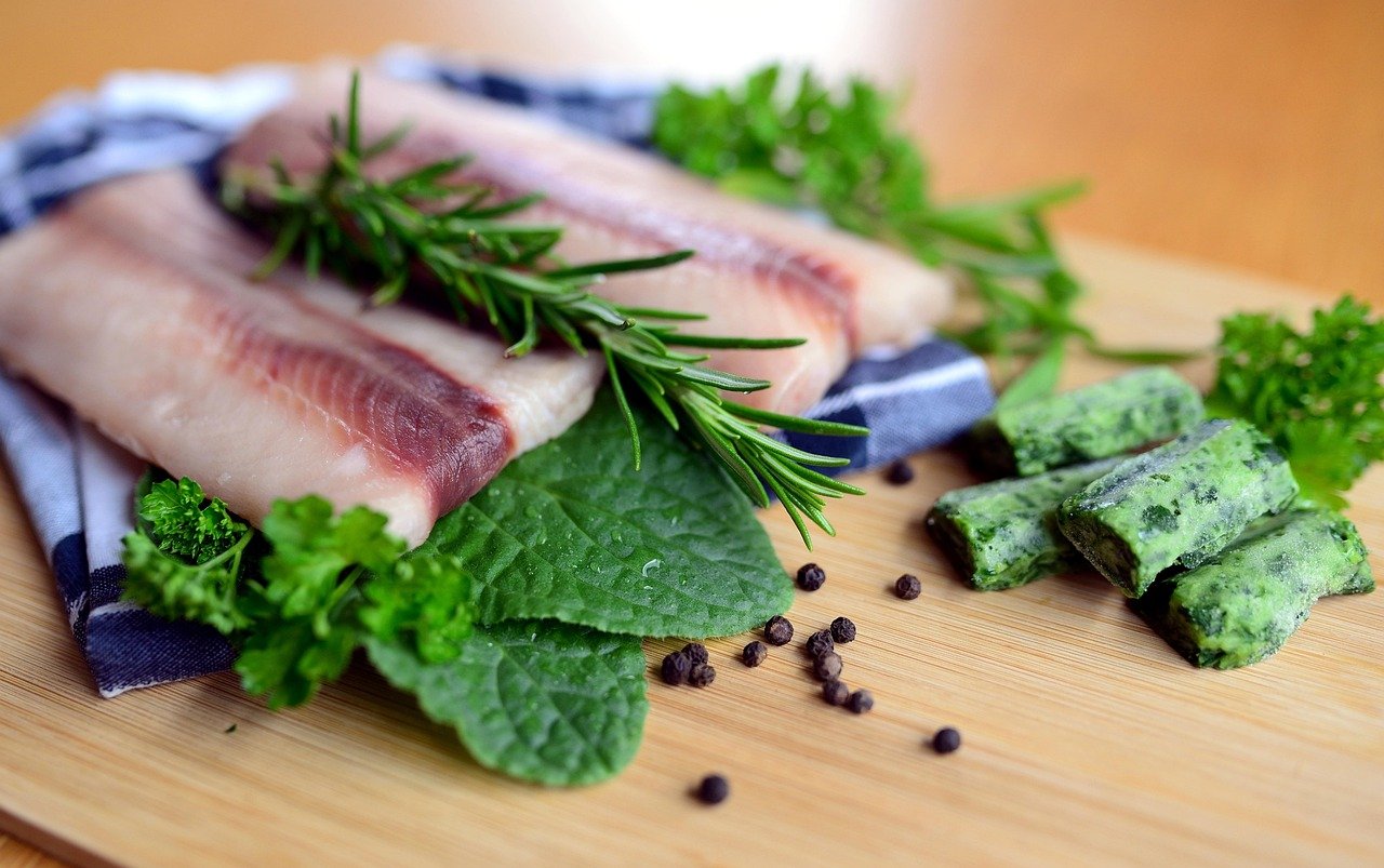 Oily fish with fresh herbs, a food source of omega-3 for beauty from within